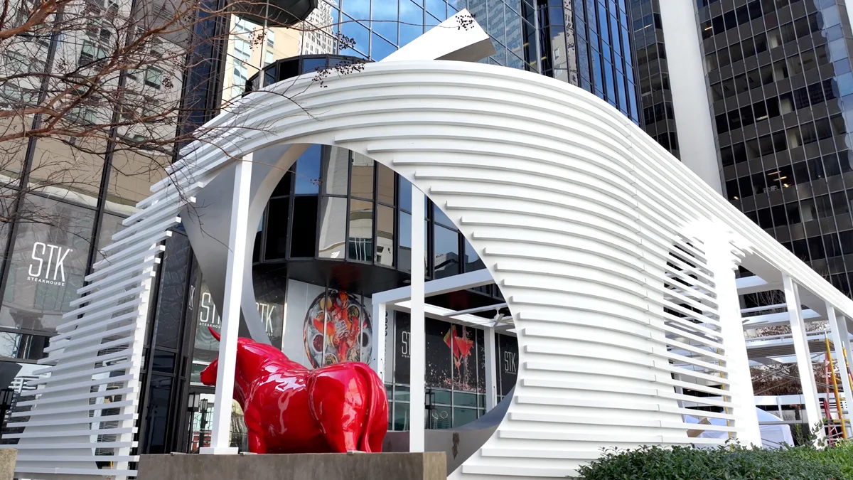 White architectural louvered canopy at a commercial building entrance